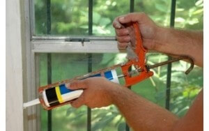 Critter Control sealing Critter Control Home window with calk